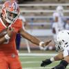 San Angelo Central quarterback Christian English tries to evade a defender in a game against Midland High in 2023.