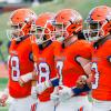 Central football captains (from left) Chase Cole, Kaden Rodgers, Mason Van Sickle and Christian English walk to midfield for the coin toss before their game against Abilene High on Friday, Aug. 30, 2024, at San Angelo Stadium.