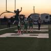 Wall's Ethan Michalewicz is picked up Ben Taylor after a touchdown against Idalou on Friday, Oct. 4, 2024.