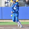 Angelo State's Carter Smith makes contact during a softball game in the 2025 season.