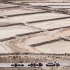 Truckers line up to receive a load of sand used in oil and gas fracking at the Capital Sand plant outside of Monahans in July 2024. Credit: Eli Hartman/The Texas Tribune