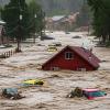 A record-breaking flash flood swept through the New Mexico mountain village of Ruidoso on Tuesday, killing at least three people, including two children.