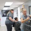 Hair stylists work at Kickin Kuts, a new barber shop on Sherwood Way.