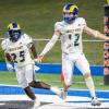 Angelo State quarterback Braeden Fuller and running back Jayden Jones celebrate a touchdown against UT Permian Basin during the 2024 season.