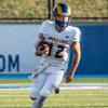 Angelo State quarterback Braeden Fuller runs for yardage against Fort Hays State on Thursday, Aug. 28, 2025.