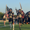 The Gordon Longhorns run onto the field before their football game against the Richland Springs Coyotes on Thursday, Aug. 28, 2025, in Priddy.