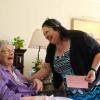 Ida Walter, seated, shares a laugh with Norma Dietz Lee, executive director of Meals for the Elderly, during Walter’s 101st birthday celebration Friday in San Angelo.
