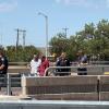 A man threatening to jump from the Main Street overpass onto the Houston Harte Expressway has been talked out of the suicide attempt by police officers.
