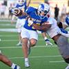 Angelo State running back Cameron Dischler battles for yardage against Sul Ross State in 2024.