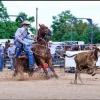 Caleb Smidt is showing roping a calf at an event in Bellville in 2014.