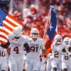 The Texas Longhorns football team runs onto the field before a game during the 2025 season.