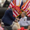 President Donald Trump greets and shakes hands with Gov. Greg Abbott in Edinburg on Nov. 19, 2023. Trump on Tuesday endorsed Abbott, who is seeking a fourth term as Texas governor.  Eddie Gaspar/The Texas Tribune