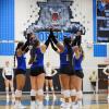 The Northwest Nelson volleyball team celebrates a point during the 2025 season.