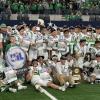 The Wall Hawks celebrate their 25-24 win over Newton in the Class 3A Division II state final on Thursday, Dec. 18, 2025, at AT&T Stadium in Arlington.