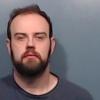Lance Mosley, the band director at Mann STEAM Academy, was arrested Thursday and charged with possession of child pornography.