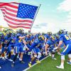 The Angelo State football team prepares to run onto the field before a game during the 2025 season.