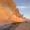 Wildfires that have raged across Kansas and the panhandles of Texas and Oklahoma have burned more than 300,000 acres this week.