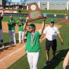 Wall baseball coach Jeremy Gordon hoists the trophy after the Hawks' state-title win over Thrall in 2025.