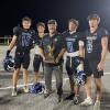 Head coach Harley Ethridge celebrates with Richland Springs after a playoff win during the 2025 football season.