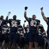 The Navy football team celebrates a win during the 2025 season.