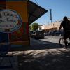 A cyclist rides their bike through downtown Del Rio on Aug. 21, 2024.