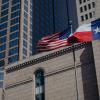 The American and Texas flags over Comerica Bank in downtown Dallas on Feb. 17, 2026.