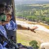 Gov. Greg Abbott surveys flooding during July, 2026.