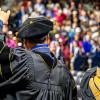 ASU’s first Psy.D. graduates, Drs. Lee Floyd and Kate Vick, acknowledge the audience at spring 2026 commencement.