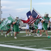 The Wall Hawks run onto the field before their game against Midland Greenwood on Friday, Sept. 25, 2026.
