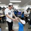 Chicago White Sox pitcher Davis Martin interacts with a young fan during the 2026 season.