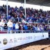 The crowd stands for the national anthem during the Cinch Roping Fiesta.