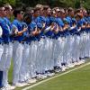 The Angelo State baseball team stands before a game during the 2025 season.