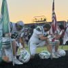 The Wall Hawks kneel before their game at Llano on Friday, Oct. 9, 2026.