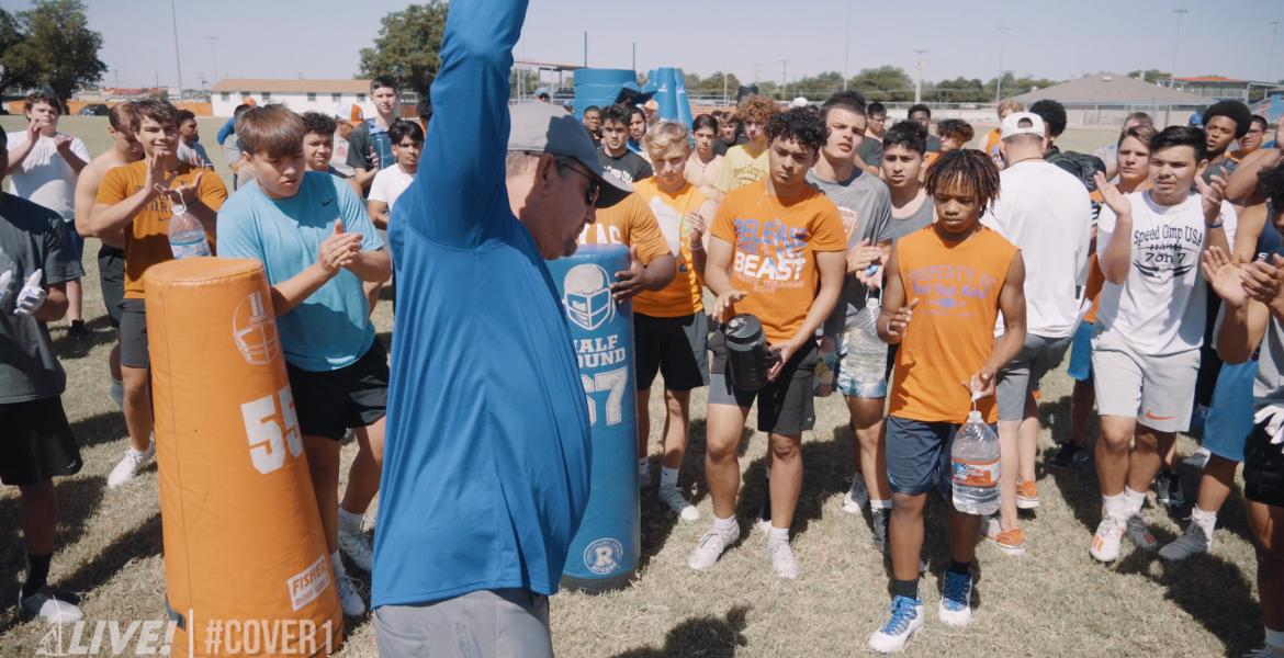 Former San Angelo Central head football coach Brent Davis talks to players during a workout.