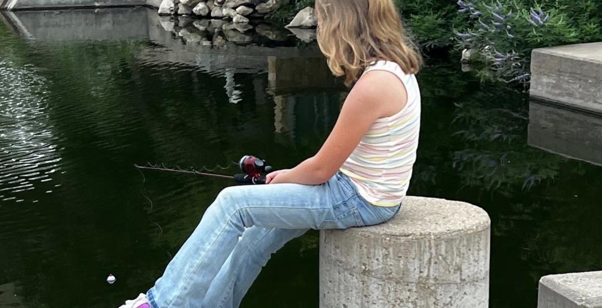 Young Lady Fishing in the Concho River Near Art Museum
