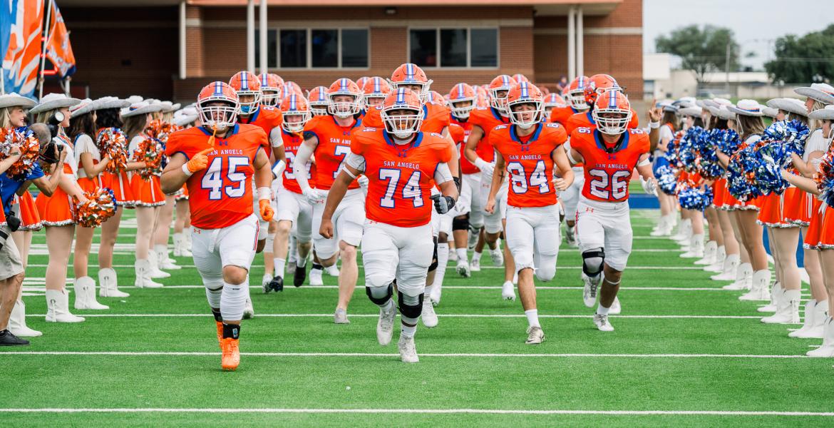 The Central Bobcats charge onto the field before their game against Abilene High on Friday, Aug. 30, 2024, at San Angelo Stadium.
