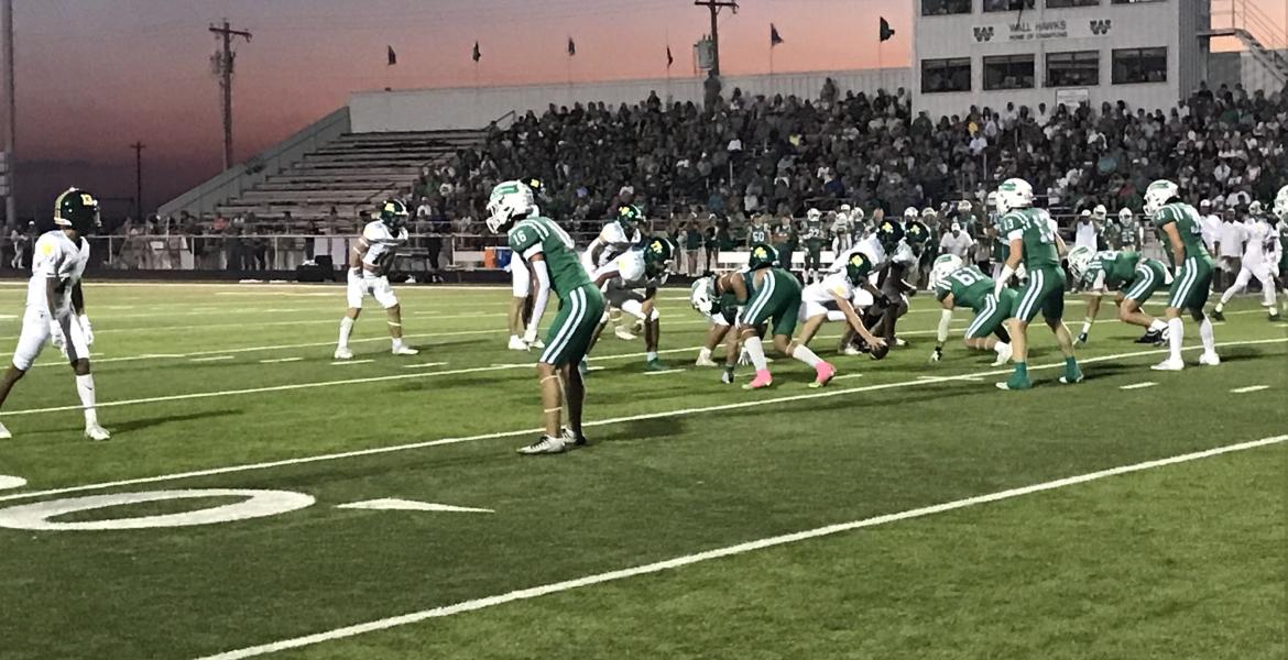 The Wall Hawks' defense prepares for the snap against Idalou on Friday, Oct. 4, 2024.