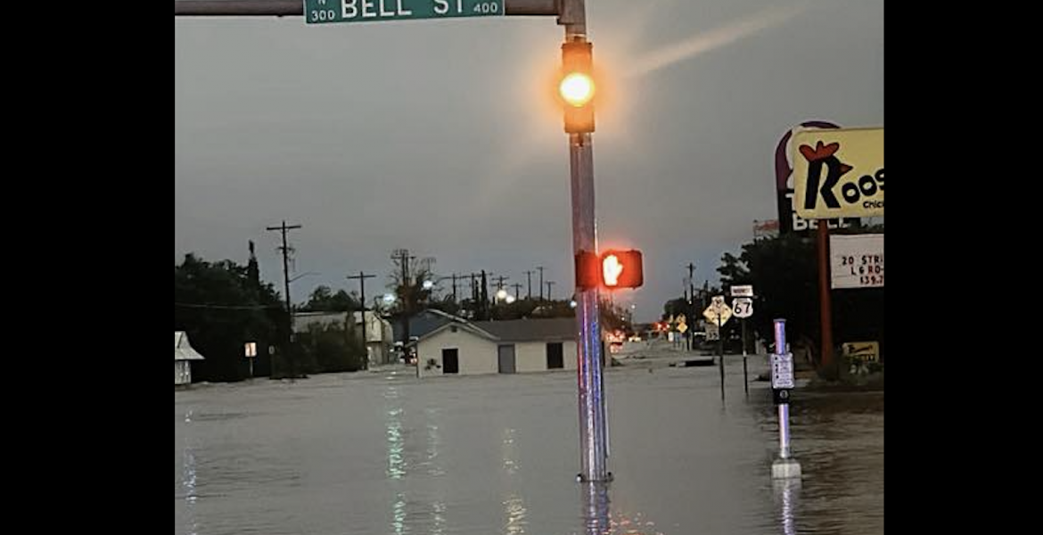 A structure is shown floating down Pulliam Street after heavy flooding in San Angelo on Friday, July 4, 2025.