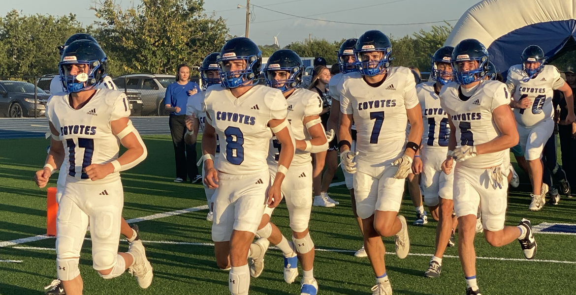 The Richland Springs Coyotes run onto the field before their football game against the Gordon Longhorns on Thursday, Aug. 28, 2025, in Priddy.