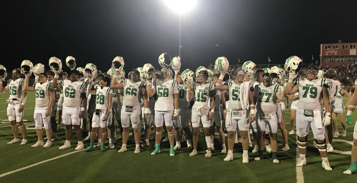 The Wall Hawks celebrate after their 24-0 win over Jim Ned on Friday, Sept. 12, in Tuscola.