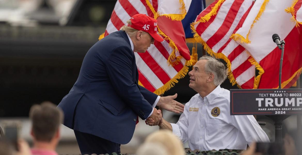 President Donald Trump greets and shakes hands with Gov. Greg Abbott in Edinburg on Nov. 19, 2023. Trump on Tuesday endorsed Abbott, who is seeking a fourth term as Texas governor.  Eddie Gaspar/The Texas Tribune