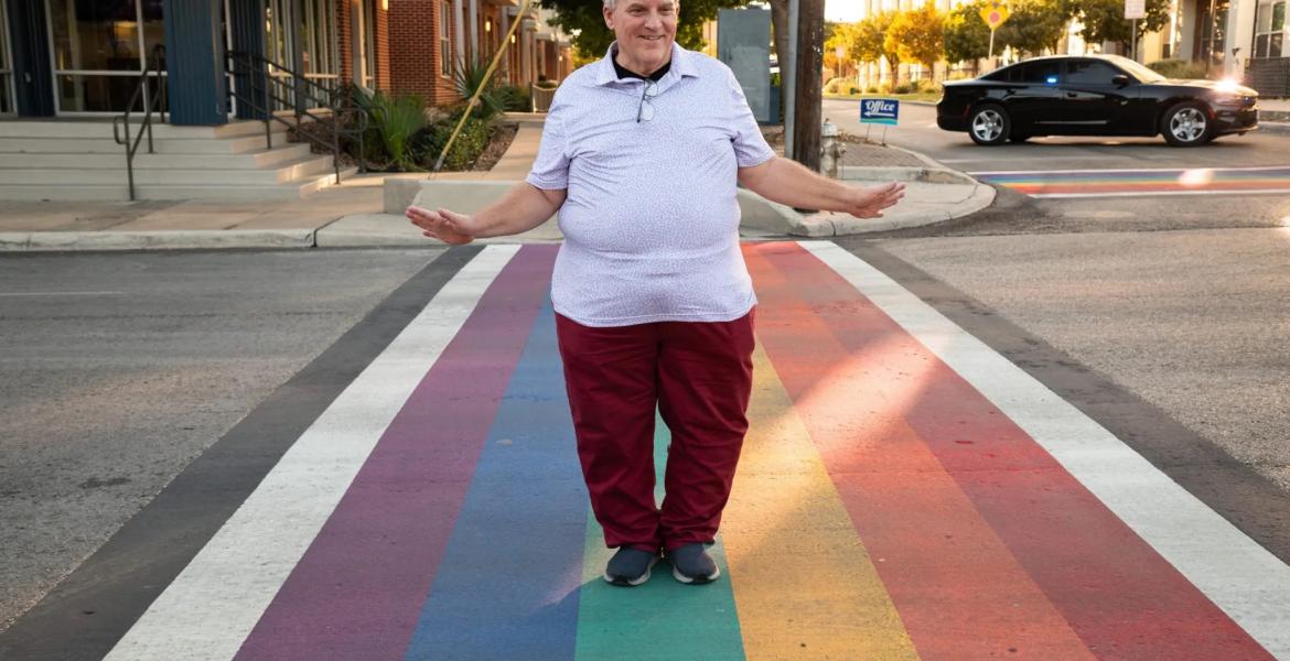 James Poindexter, Pride San Antonio Board Member, at the rainbow crosswalk in the city’s Pride Cultural Heritage District on Thursday. Poindexter helped organize the event where several community members, city officials, and leaders of LGBTQ+ and ally organizations rallied and signed a resolution urging the city to challenge Gov. Greg Abbott’s order to remove rainbow crosswalks throughout Texas.