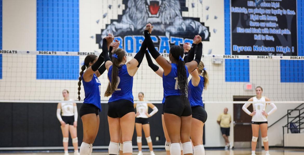 The Northwest Nelson volleyball team celebrates a point during the 2025 season.