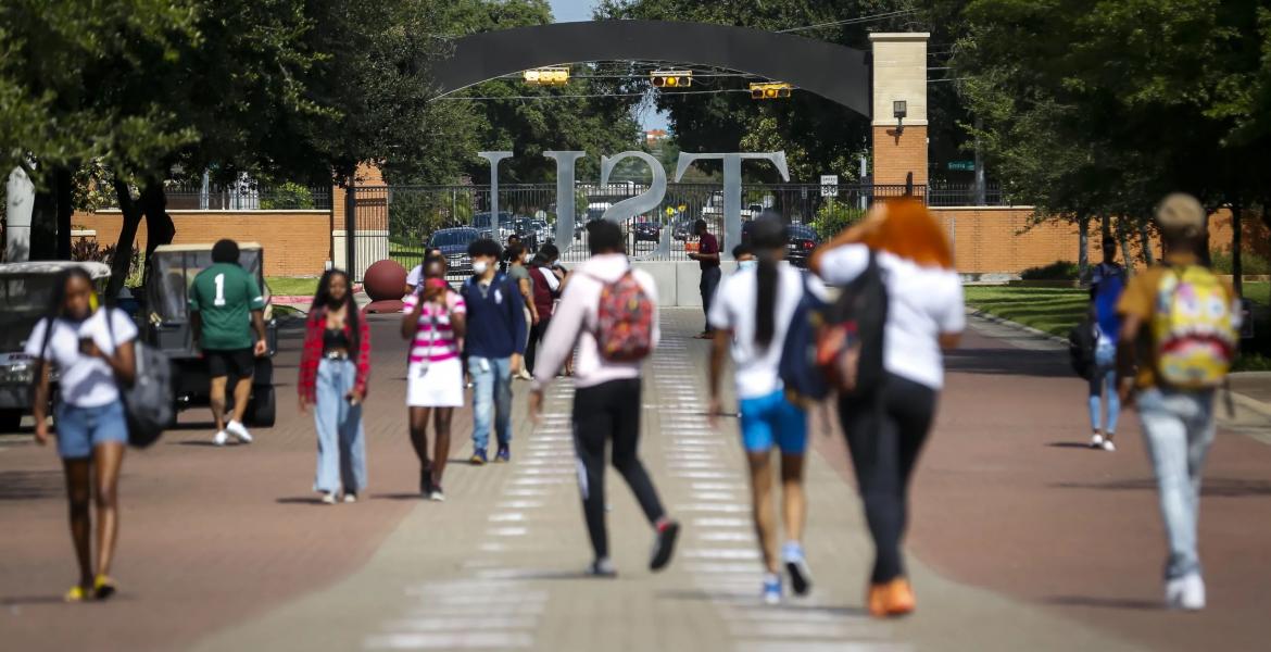 Students walk along the Tiger Walk through campus on the first day of class at Texas Southern University on Monday, Aug. 23, 2021.