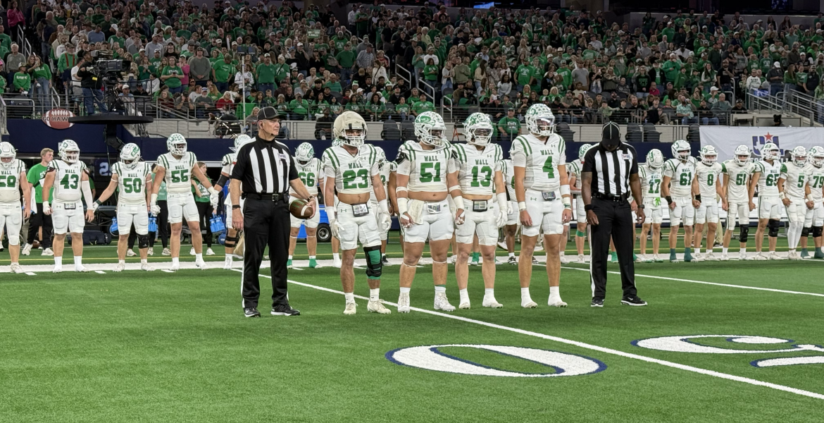 Wall's captains walk to midfield for the coin toss before their Class 3A Division II state final against Newton on Thursday, Dec. 18, 2025.