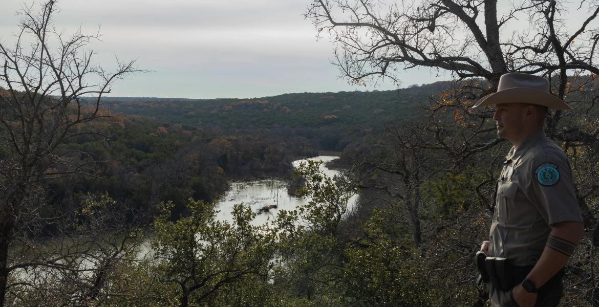 Park Superintendent James Adams looks out at Russell Creek, which feeds into Tucker Lake at Palo Pinto Mountains State Park near Strawn on Dec. 15, 2025. The park, expected to open in 2026, offered guided hikes on New Years Day to guests who made reservations.