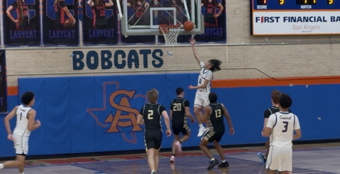 Central's Ean McNeill goes up for 2 points