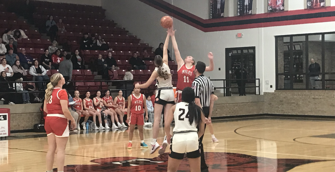 Ballinger's Ysee Le Borgne and Miles' Rylee Vanlenkamp jump for the opening tip Wednesday, Jan. 28, 2026, in Ballinger.