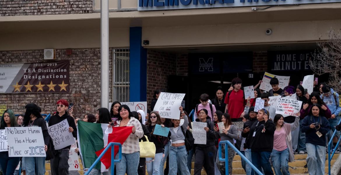 Students from San Antonio's Memorial High School walk out in protest against Immigration and Customs Enforcement (ICE) on Jan. 30, 2026. School staff and Edgewood ISD police officers blocked access to public sidewalks and the road in front of the campus saying that school property was extended for student safety. Students were directed back to class after the brief demonstration.
