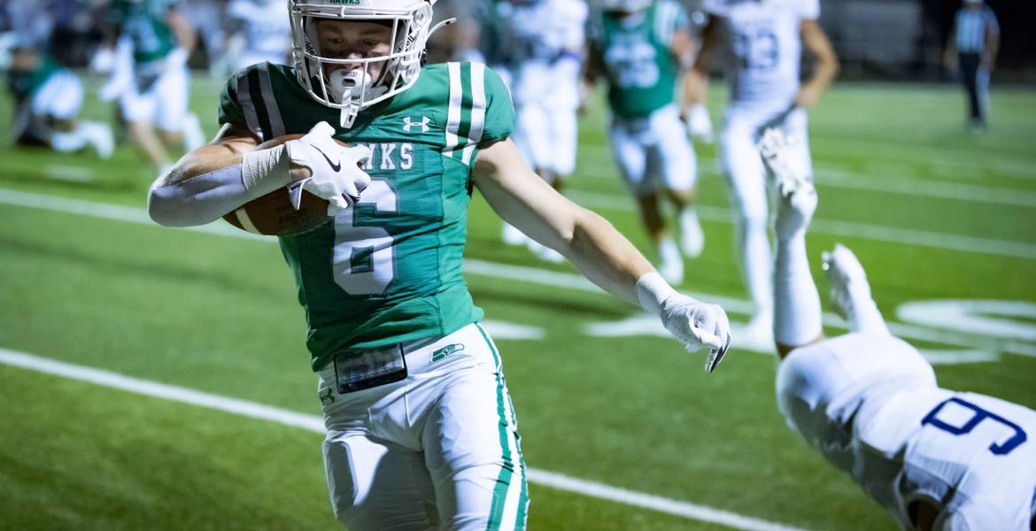Wall running back Brady Neal gains yardage in the Hawks' 2025 season opener against Mason.